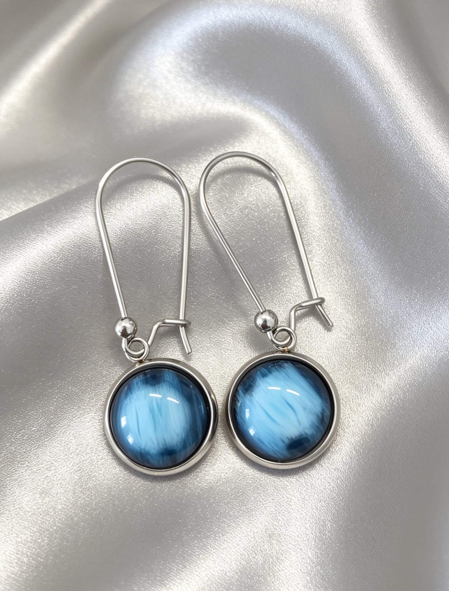 Drop Earrings with round charm in silver tone