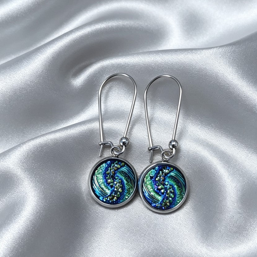 Drop Earrings with round charm in silver tone