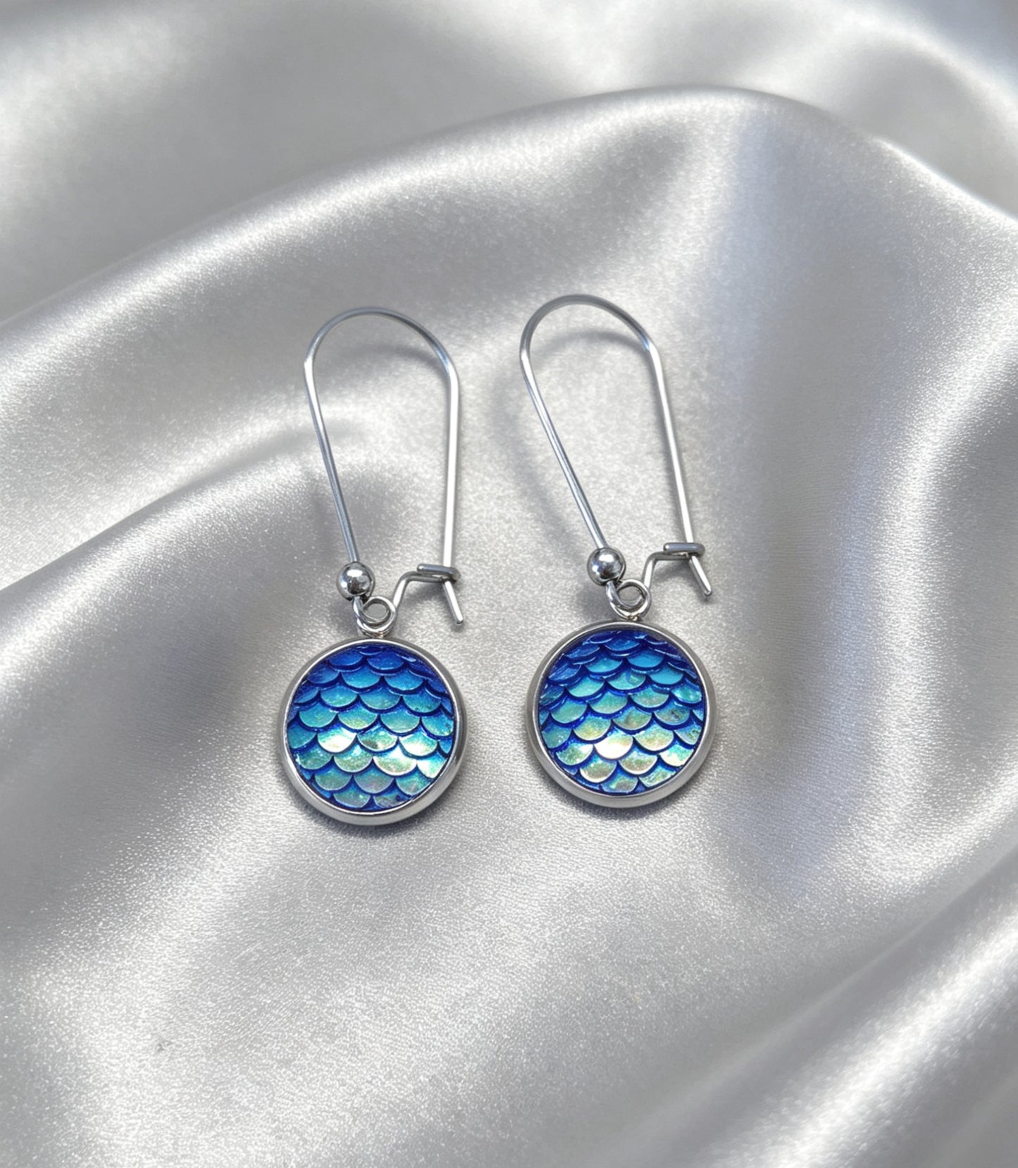 Drop Earrings with round charm in silver tone