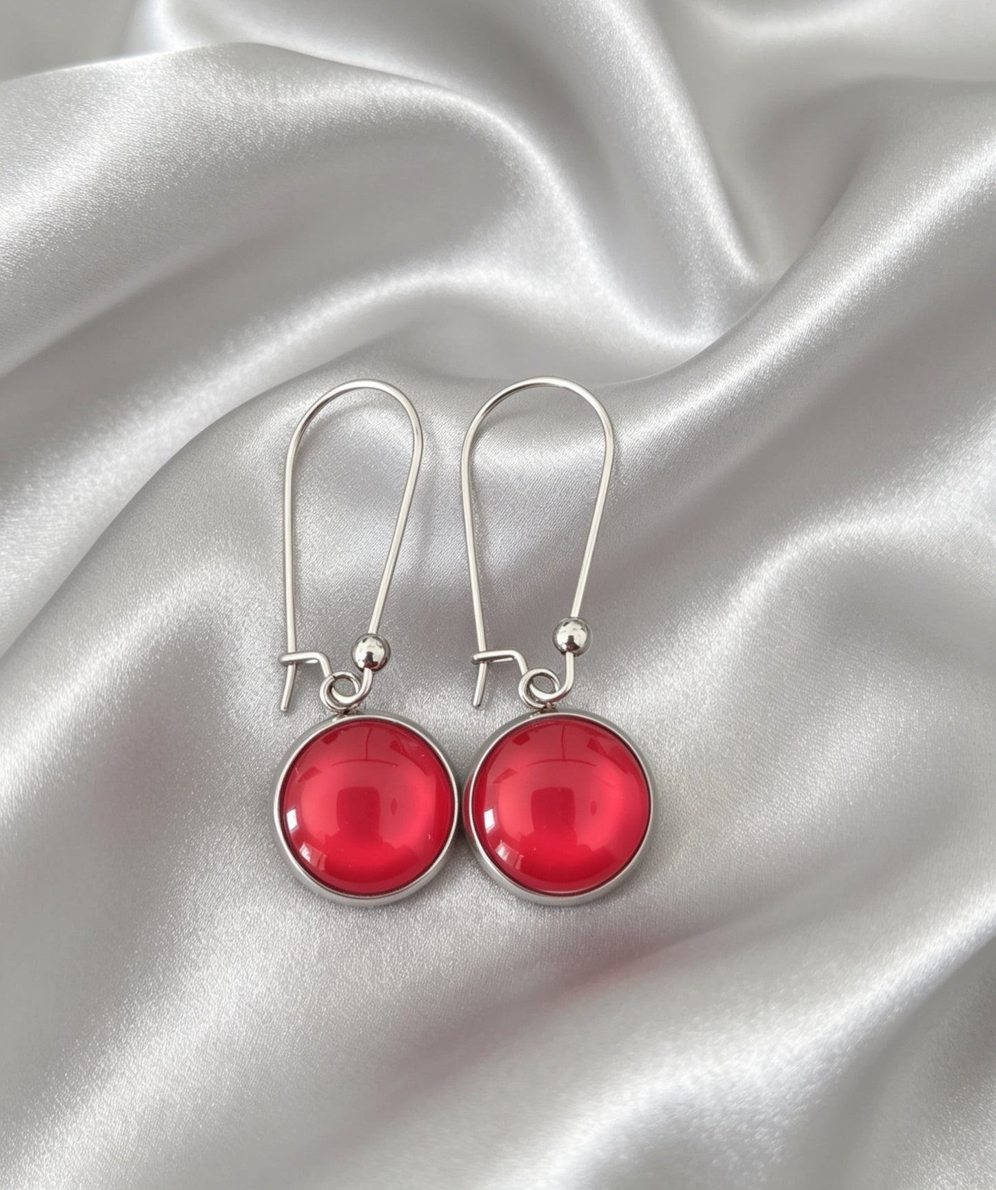 Drop Earrings with round charm in silver tone