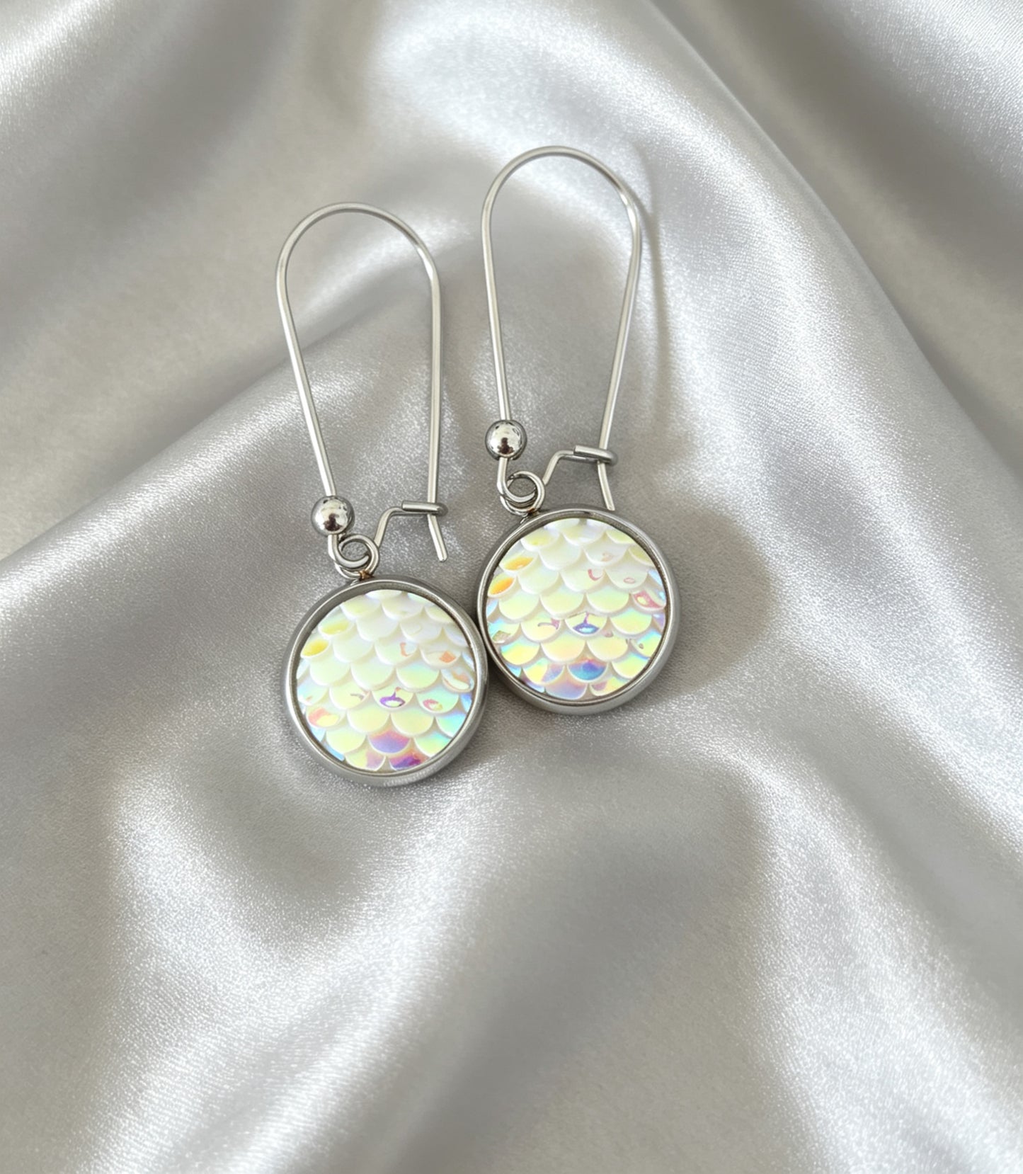 Drop Earrings with round charm in silver tone