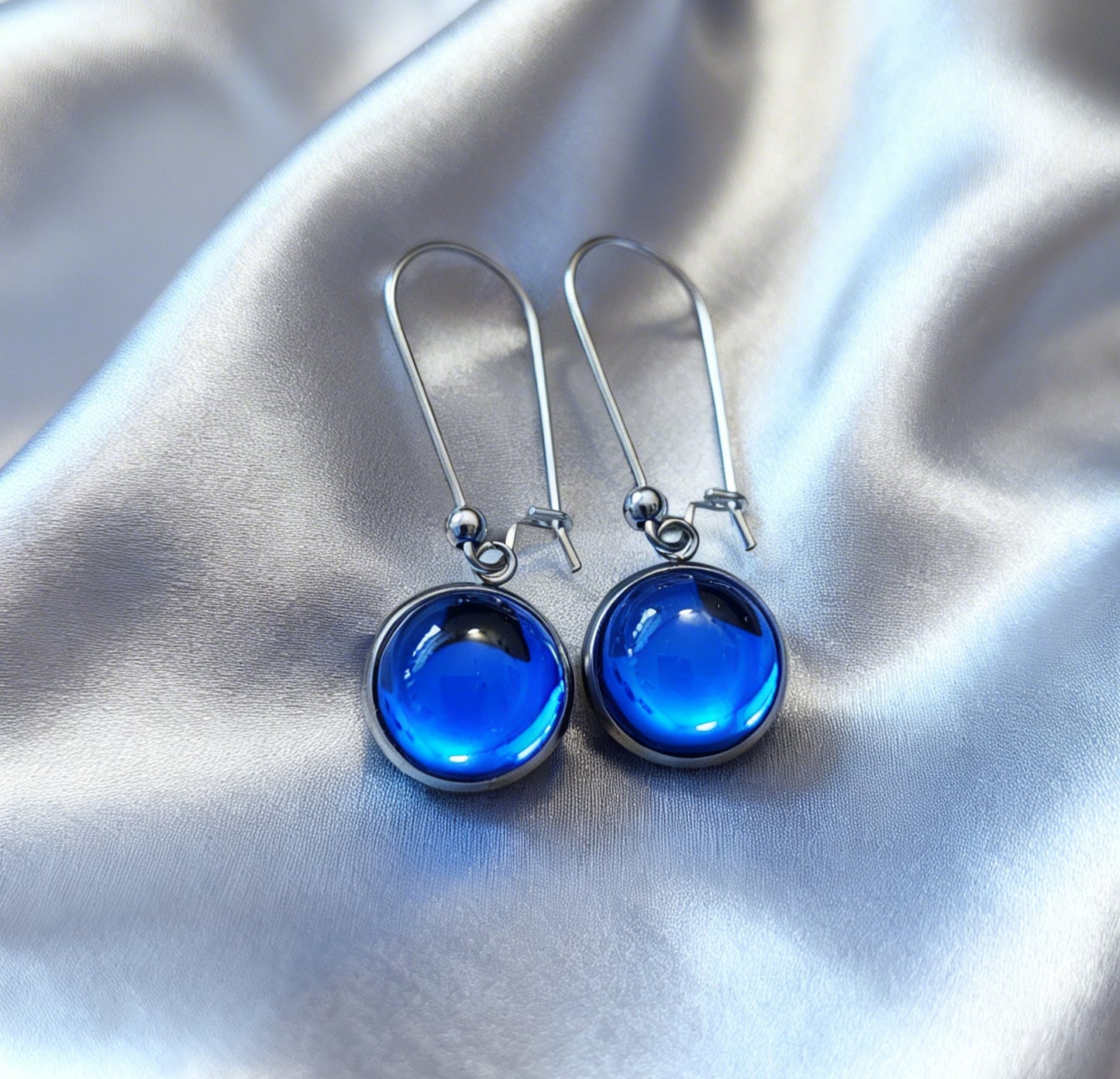 Drop Earrings with round charm in silver tone