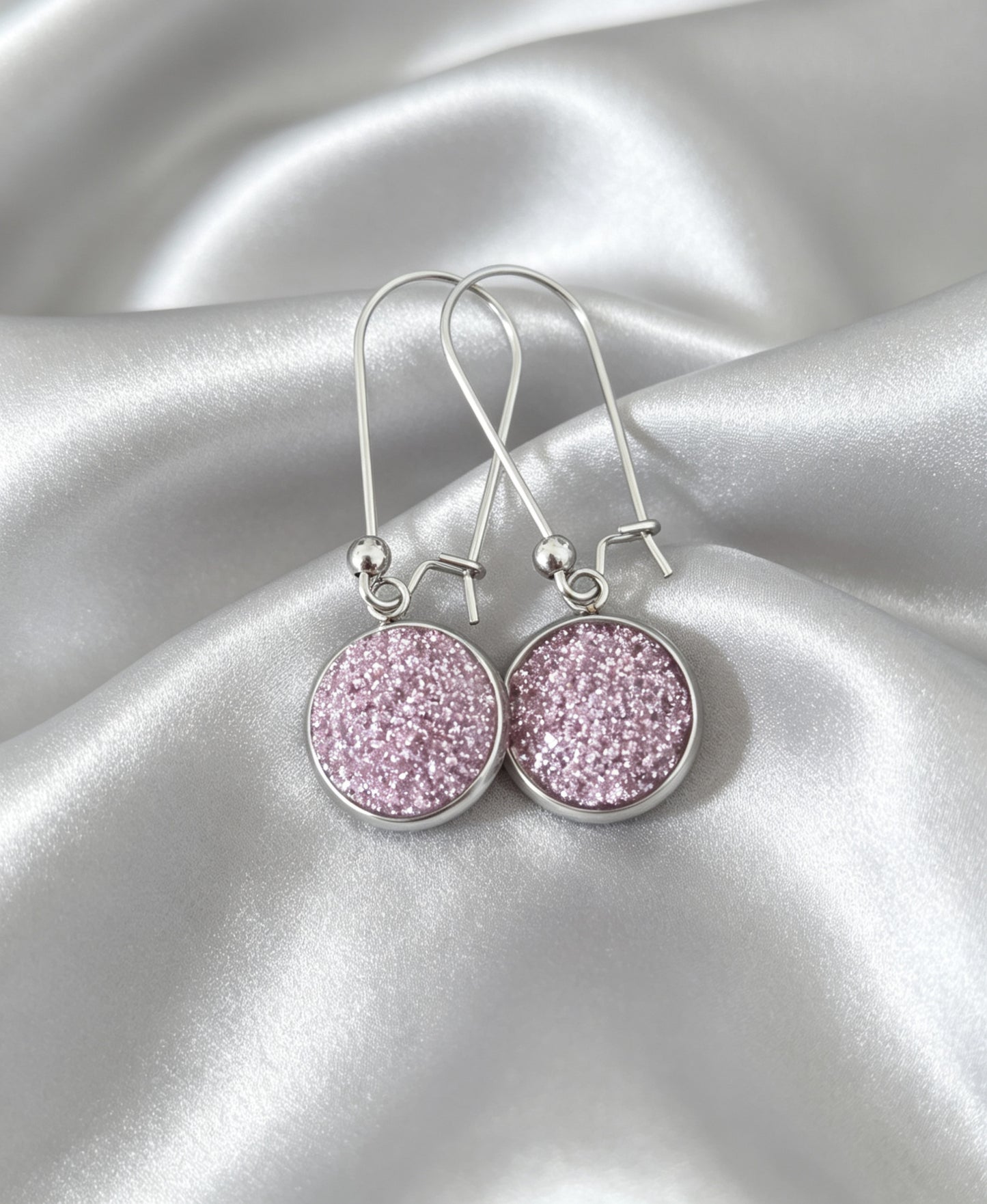 Drop Earrings with round charm in silver tone