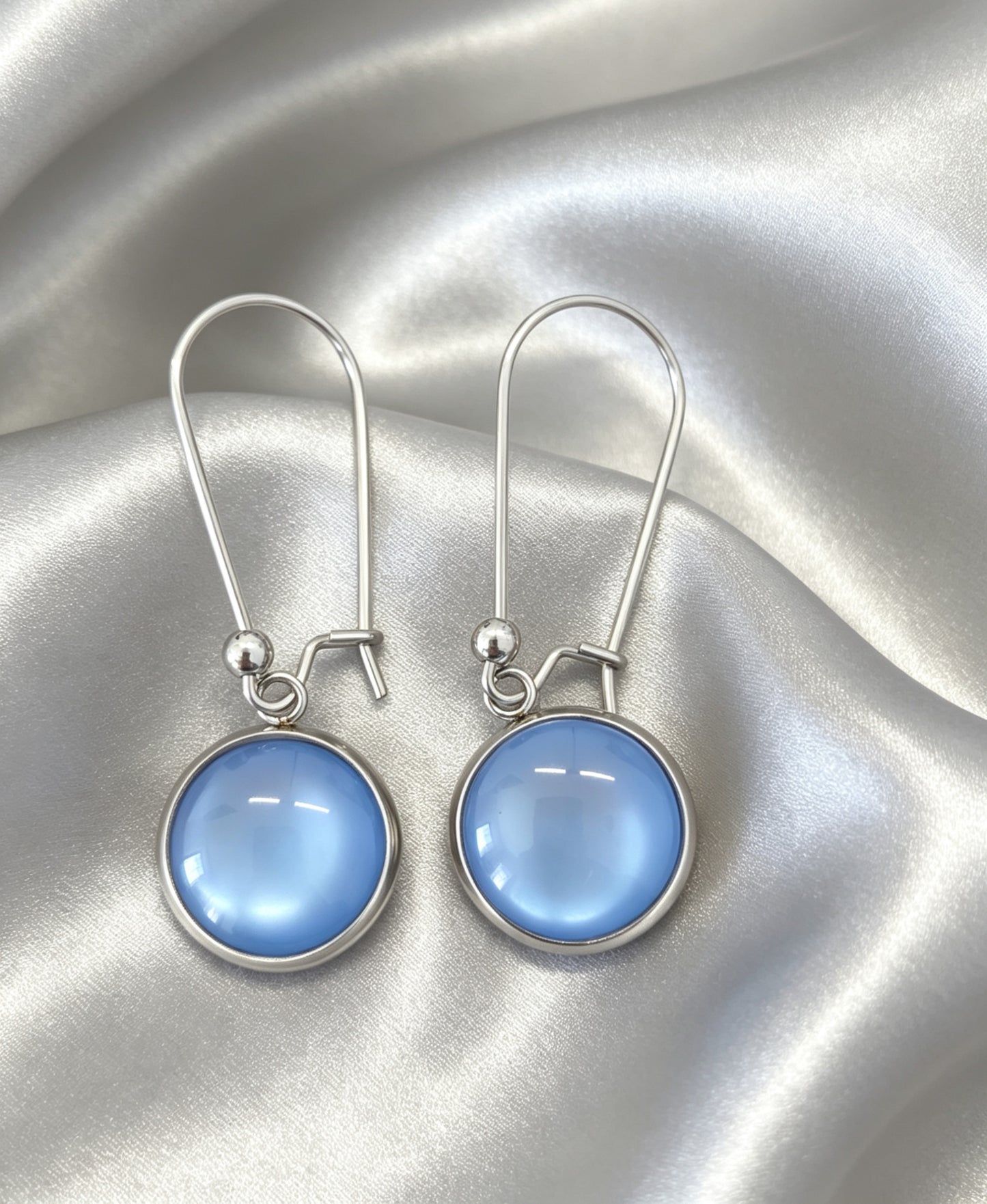 Drop Earrings with round charm in silver tone