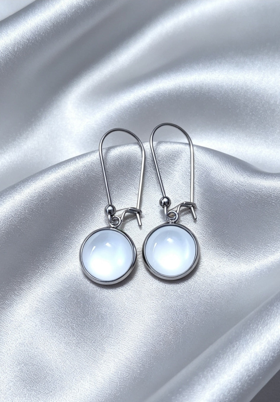 Drop Earrings with round charm in silver tone