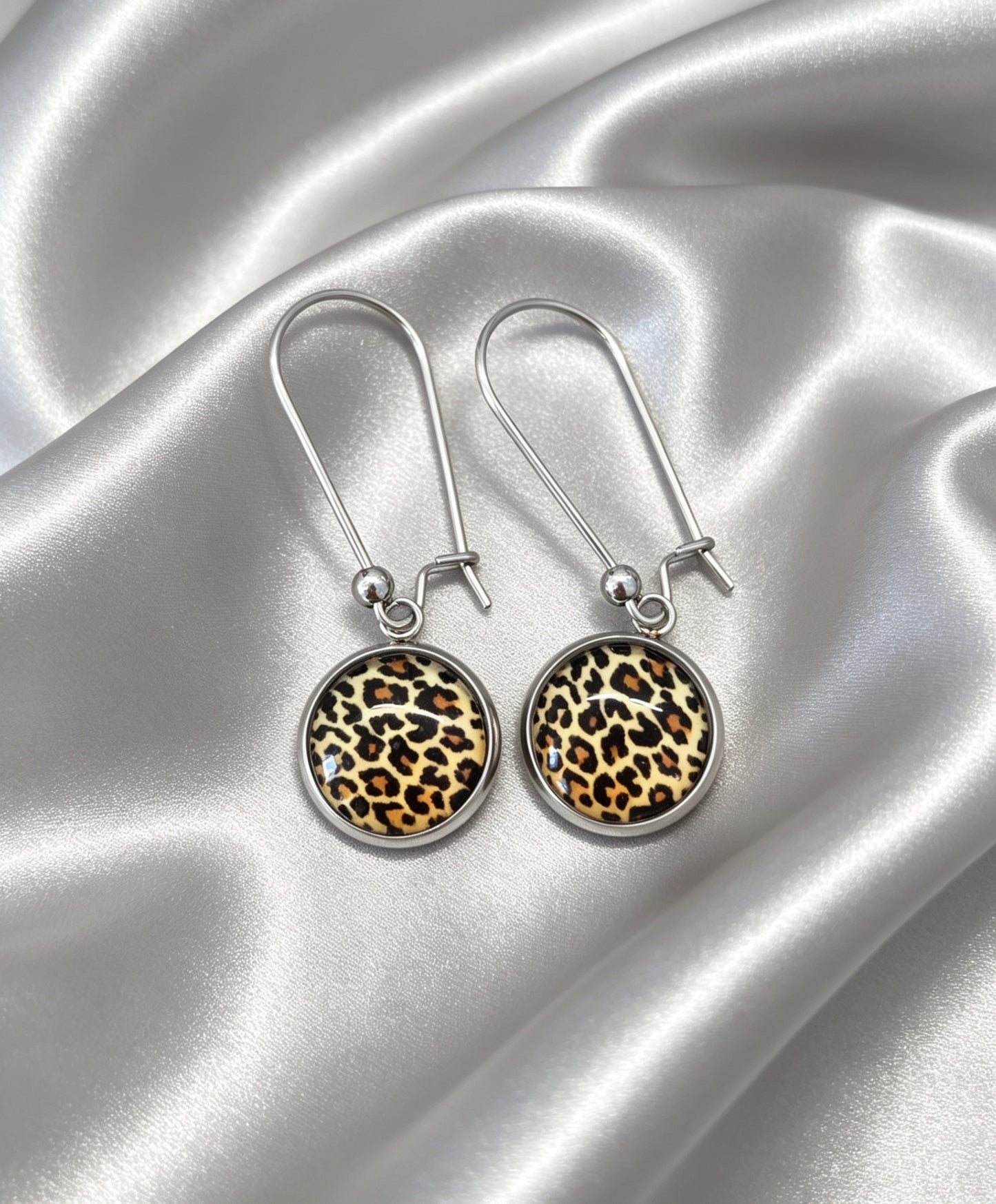 Drop Earrings with round charm in silver tone