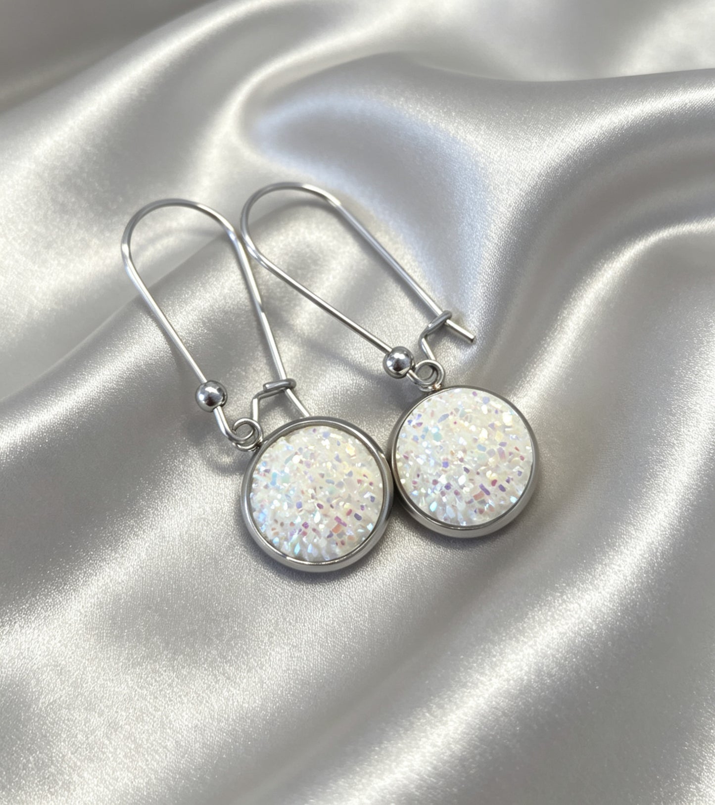 Drop Earrings with round charm in silver tone