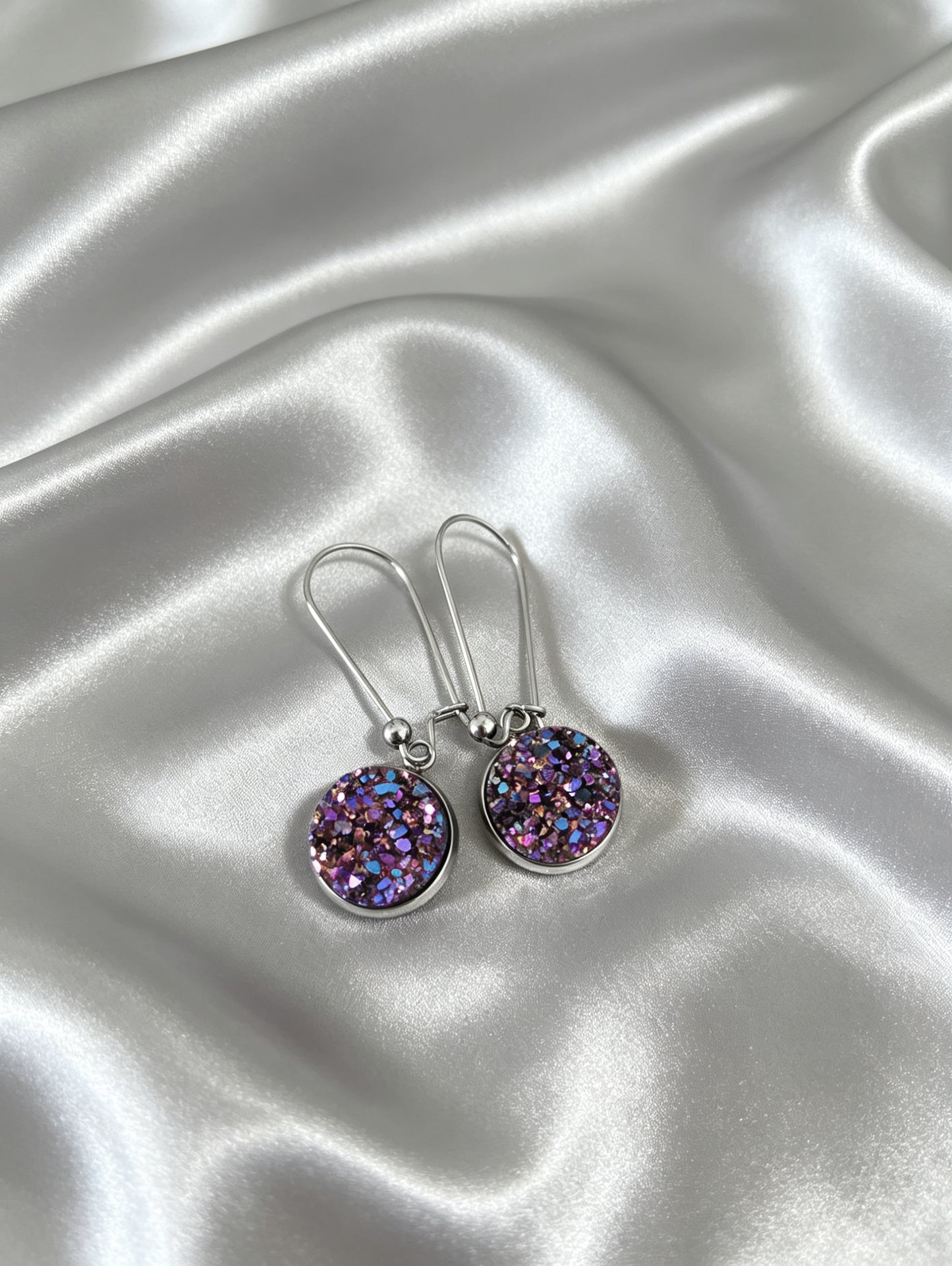 Drop Earrings with round charm in silver tone