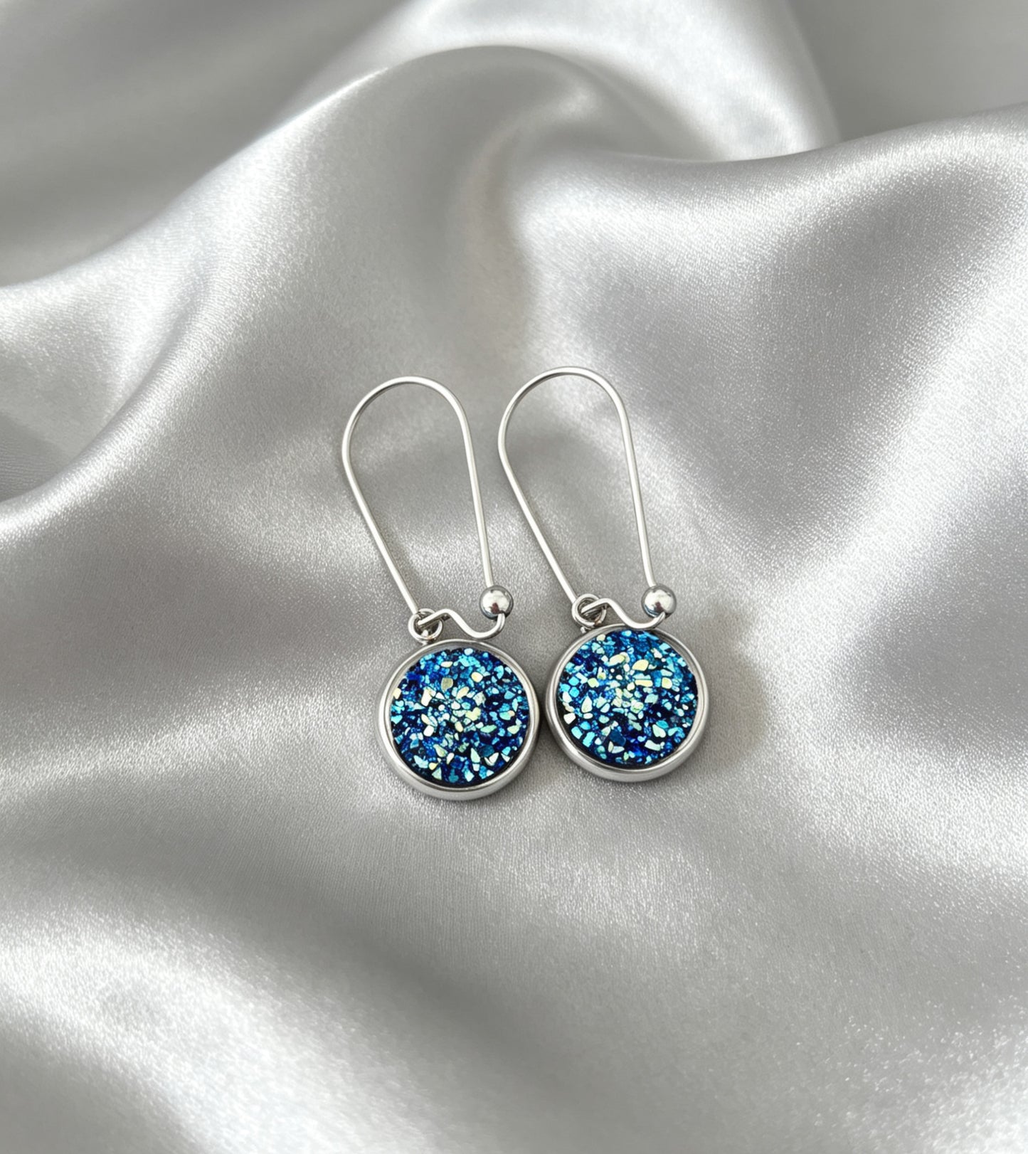 Drop Earrings with round charm in silver tone