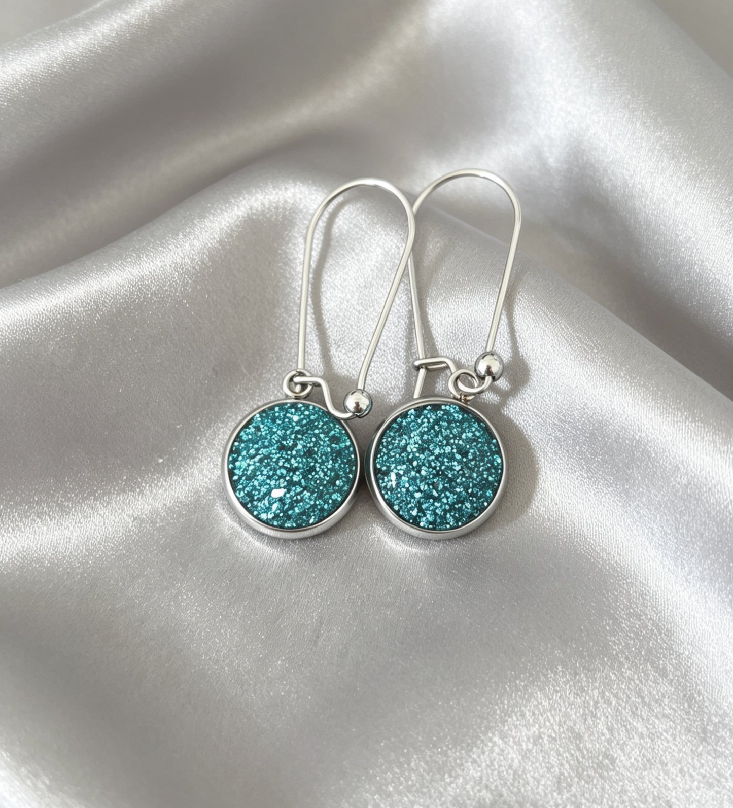 Drop Earrings with round charm in silver tone