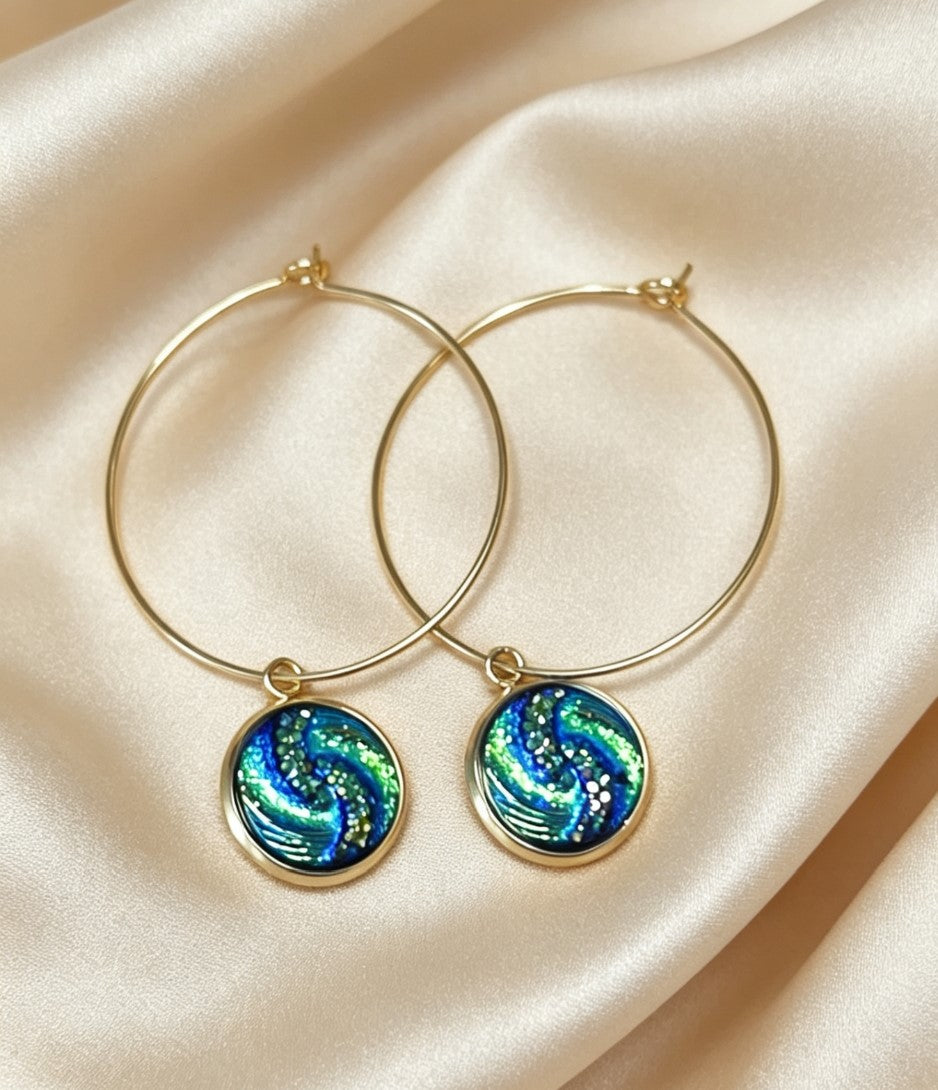 Hoop Earrings with round charm in gold tone