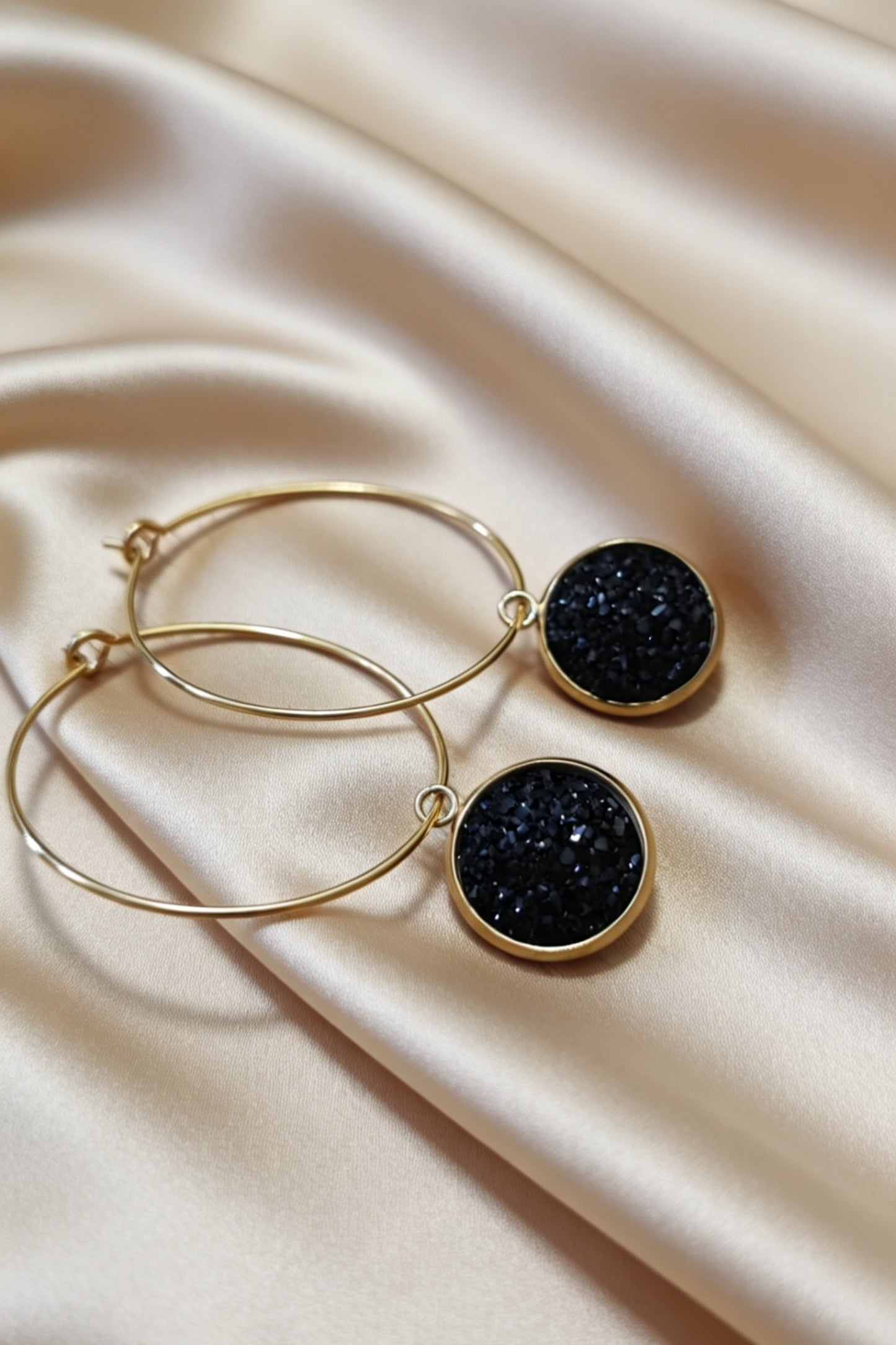 Hoop Earrings with round charm in gold tone