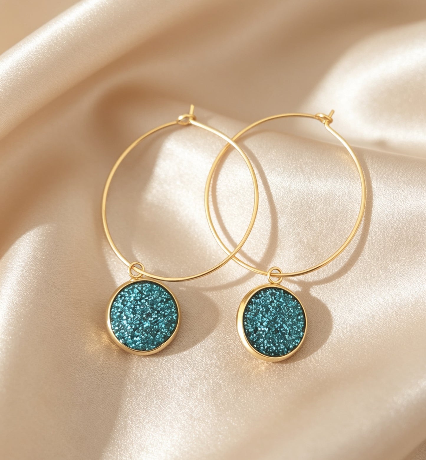 Hoop Earrings with round charm in gold tone