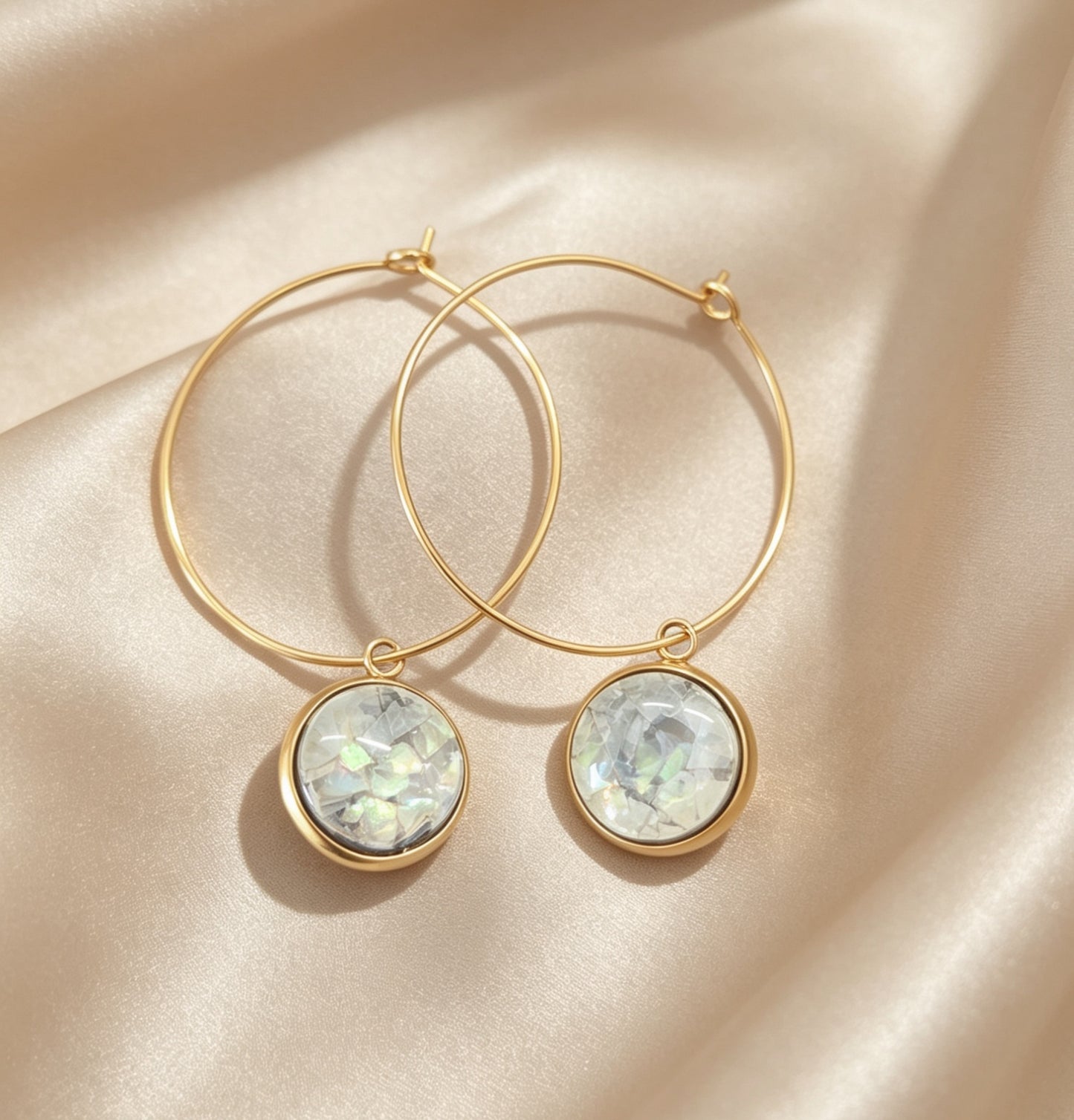 Hoop Earrings with round charm in gold tone