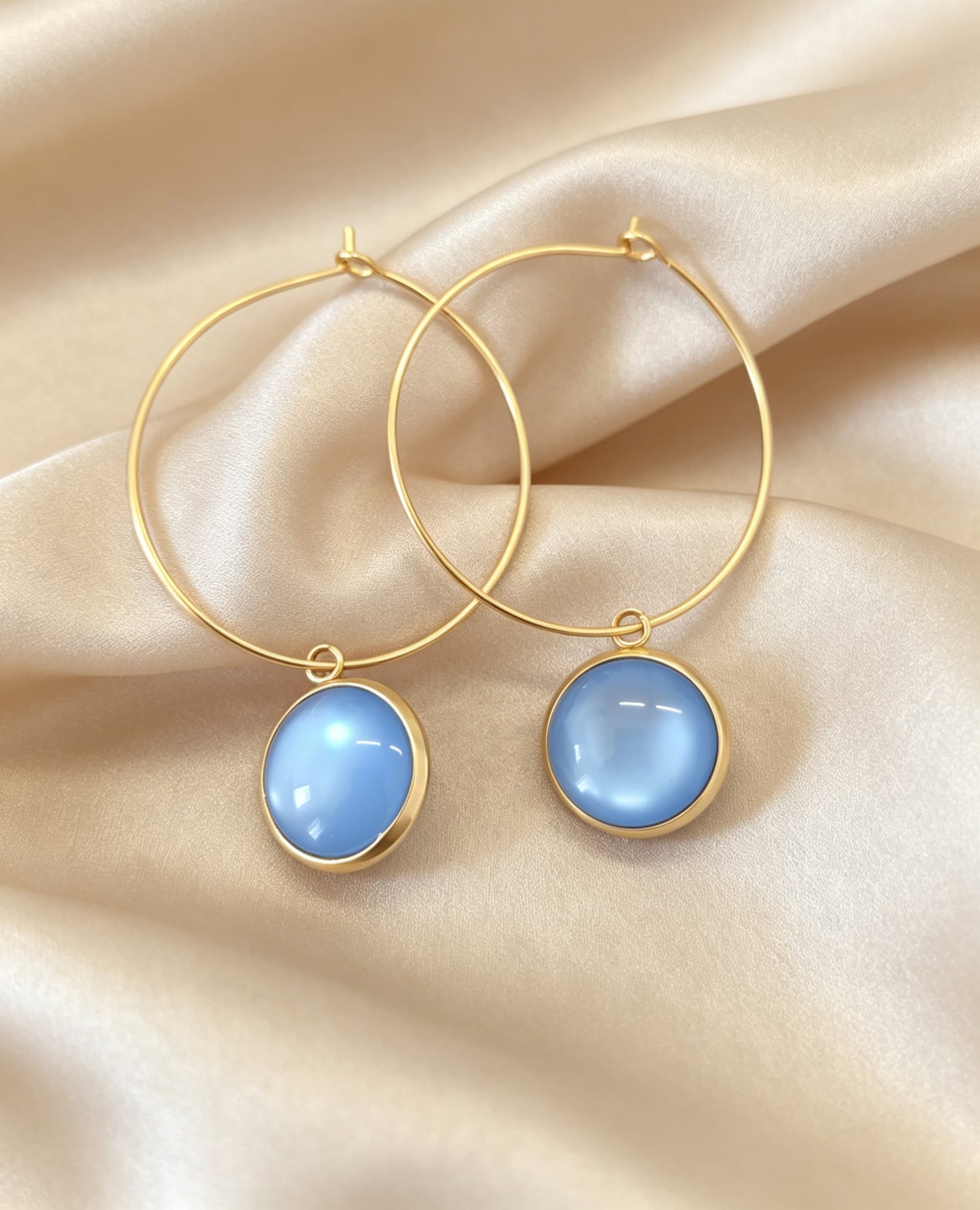 Hoop Earrings with round charm in gold tone