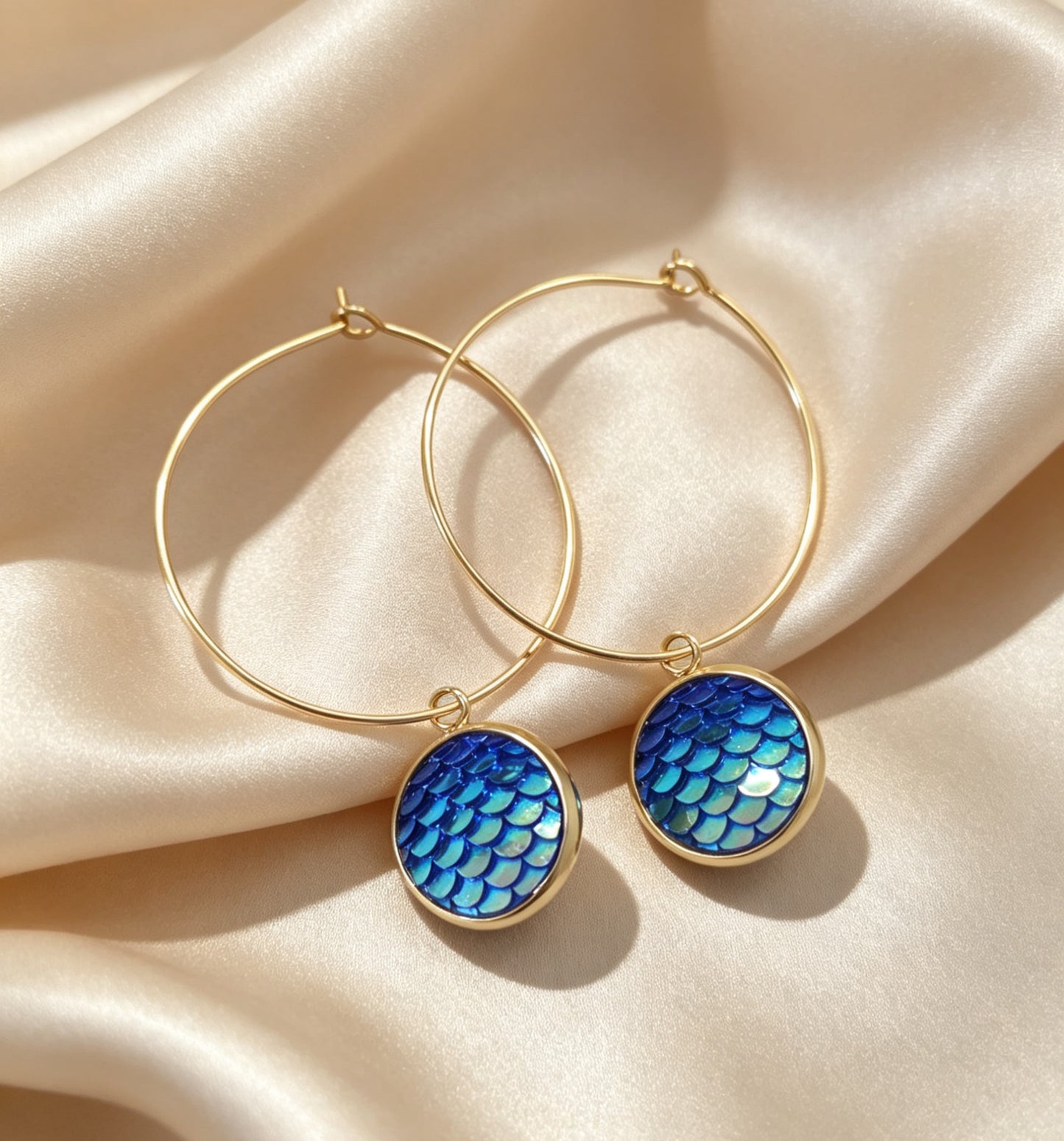 Hoop Earrings with round charm in gold tone