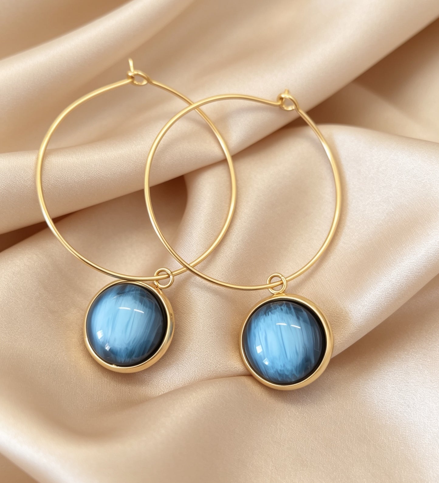 Hoop Earrings with round charm in gold tone