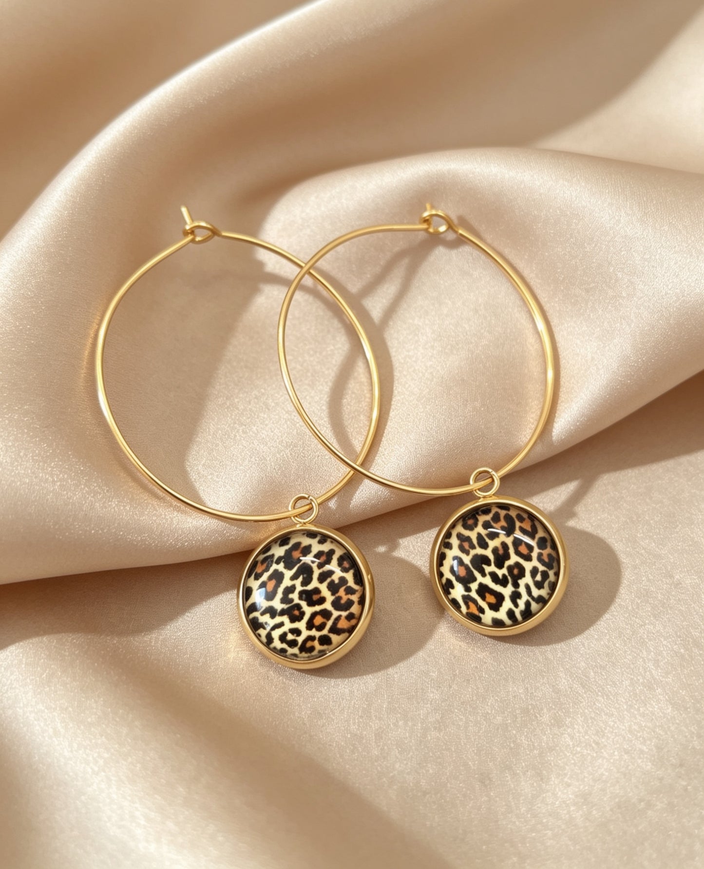 Hoop Earrings with round charm in gold tone