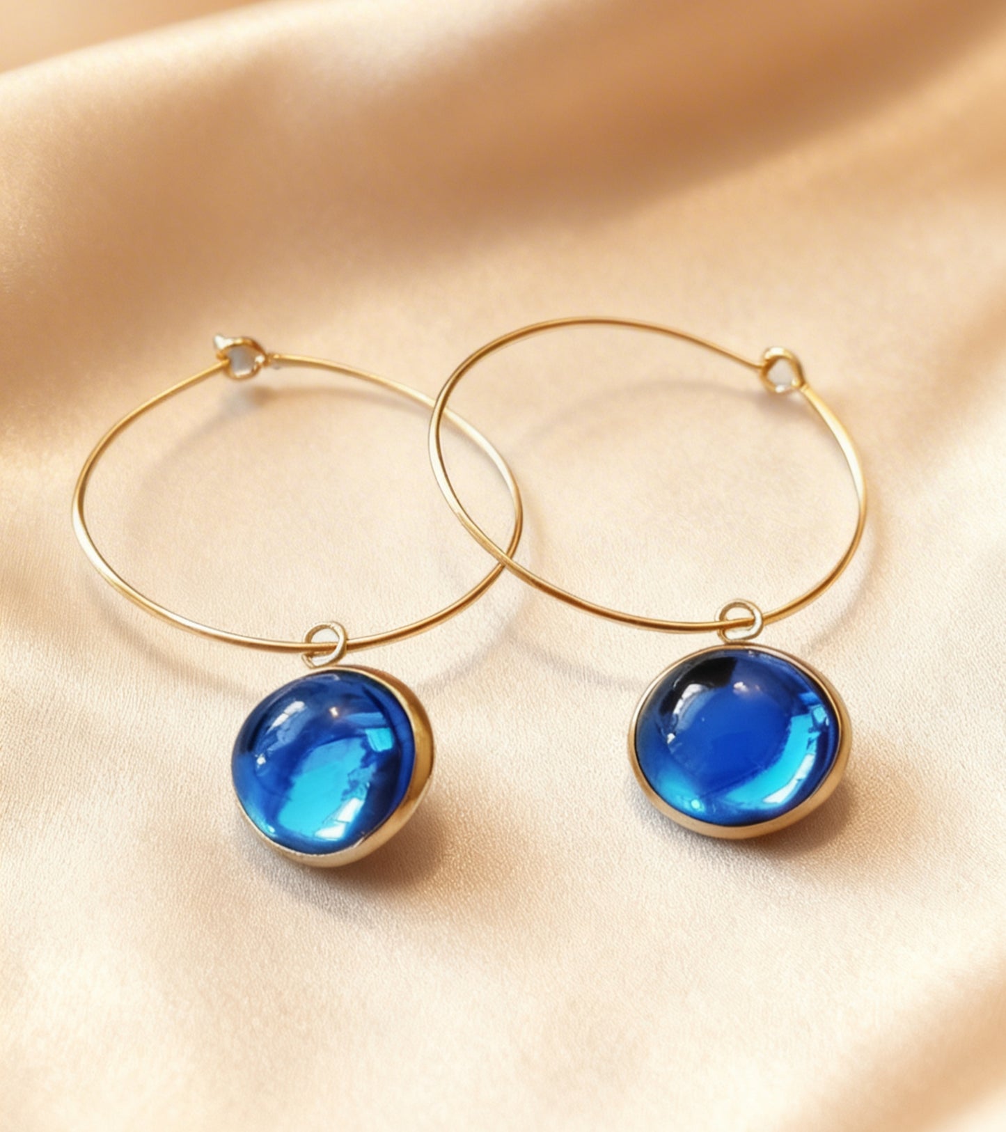Hoop Earrings with round charm in gold tone
