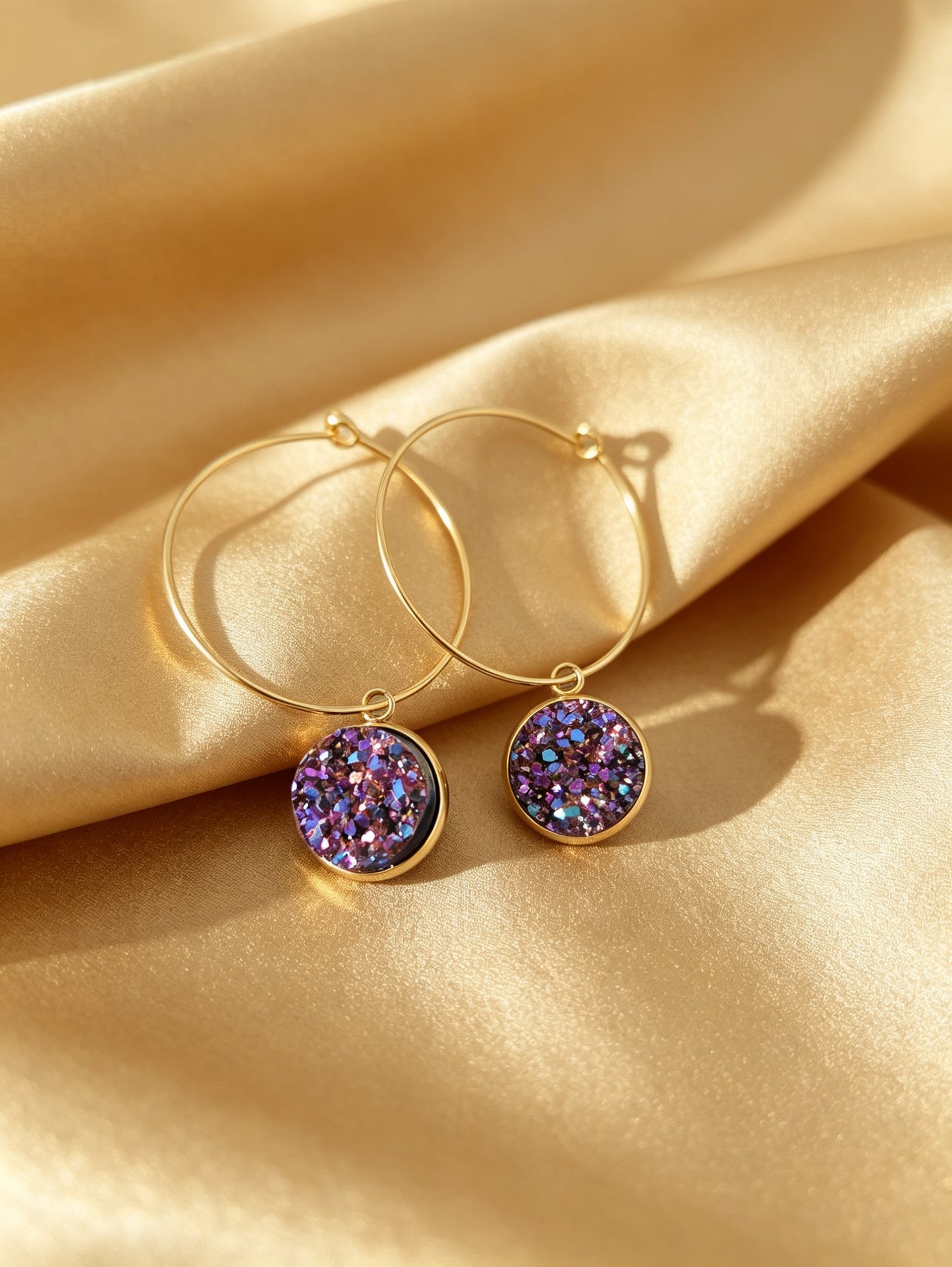 Hoop Earrings with round charm in gold tone