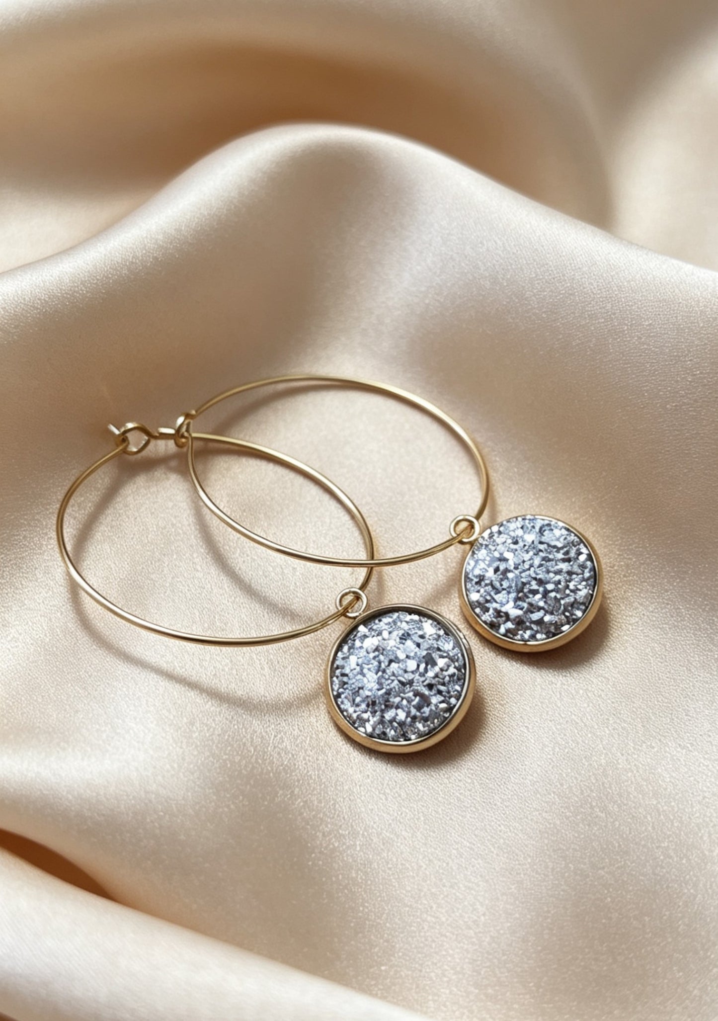 Hoop Earrings with round charm in gold tone