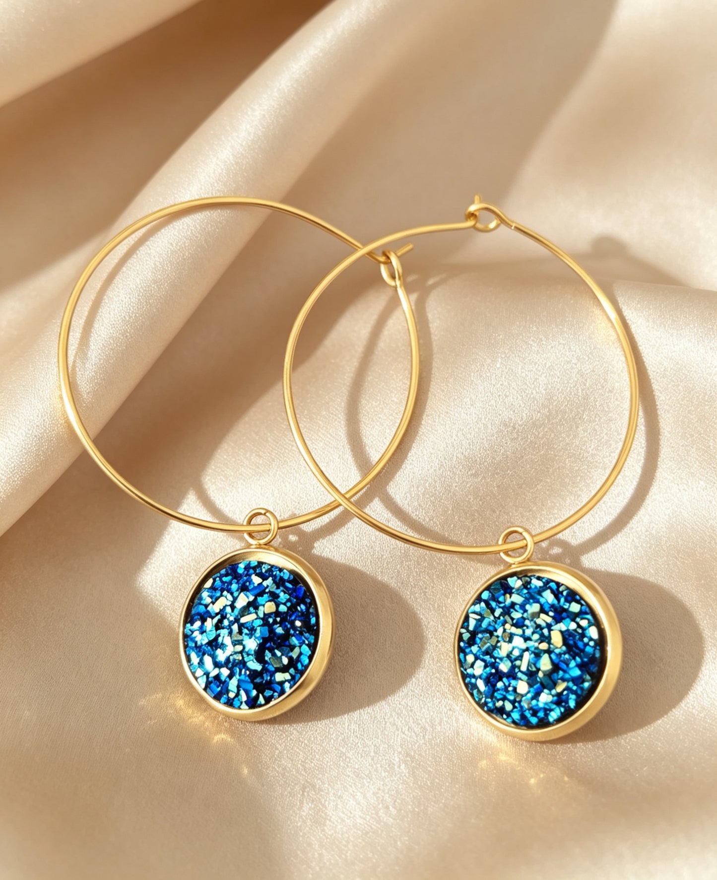 Hoop Earrings with round charm in gold tone