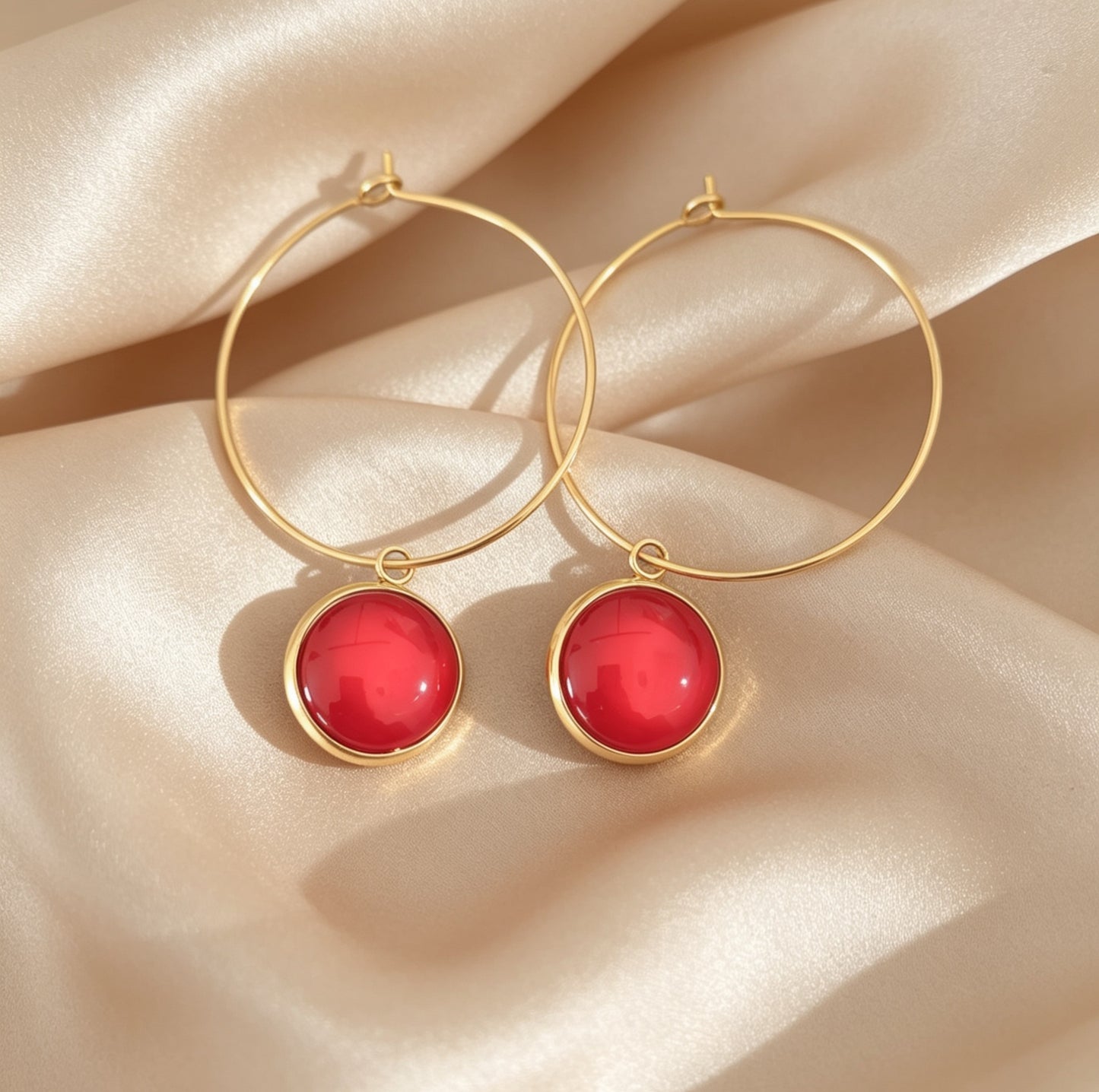 Hoop Earrings with round charm in gold tone