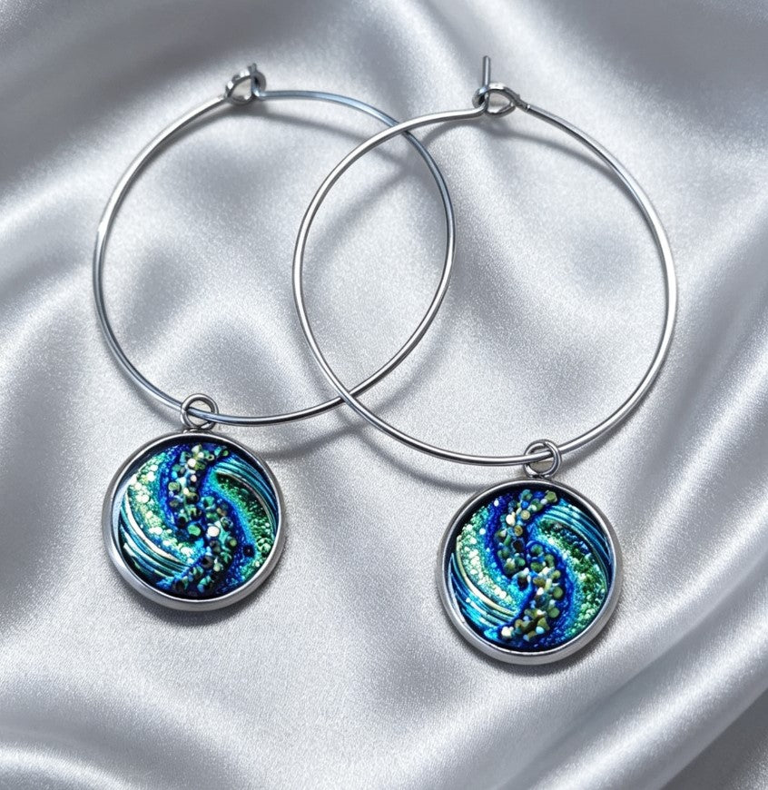 Hoop Earrings with round charm in silver tone