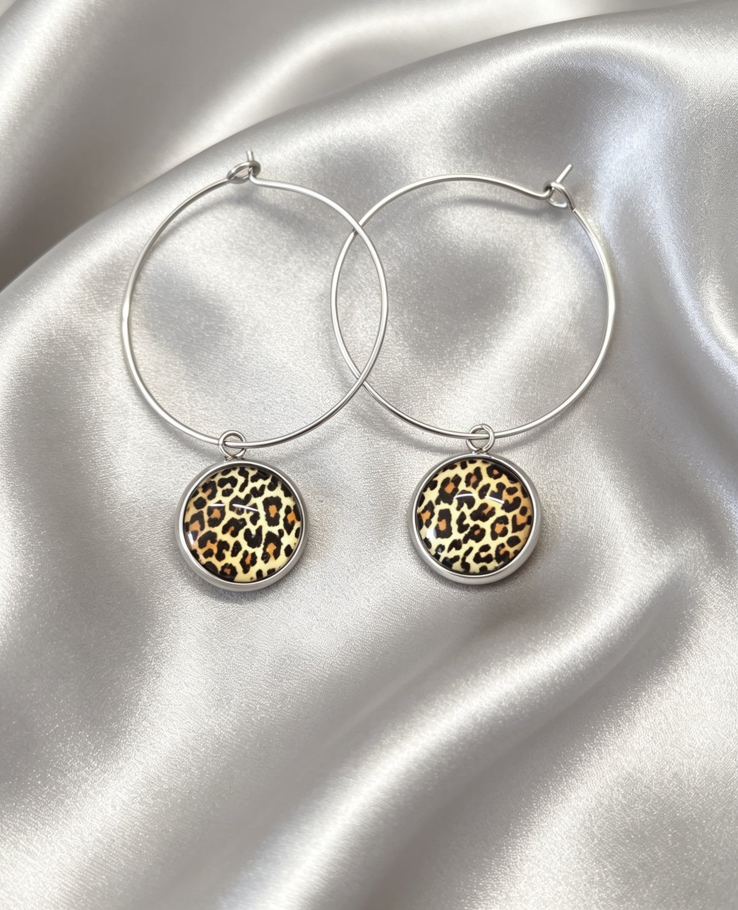 Hoop Earrings with round charm in silver tone