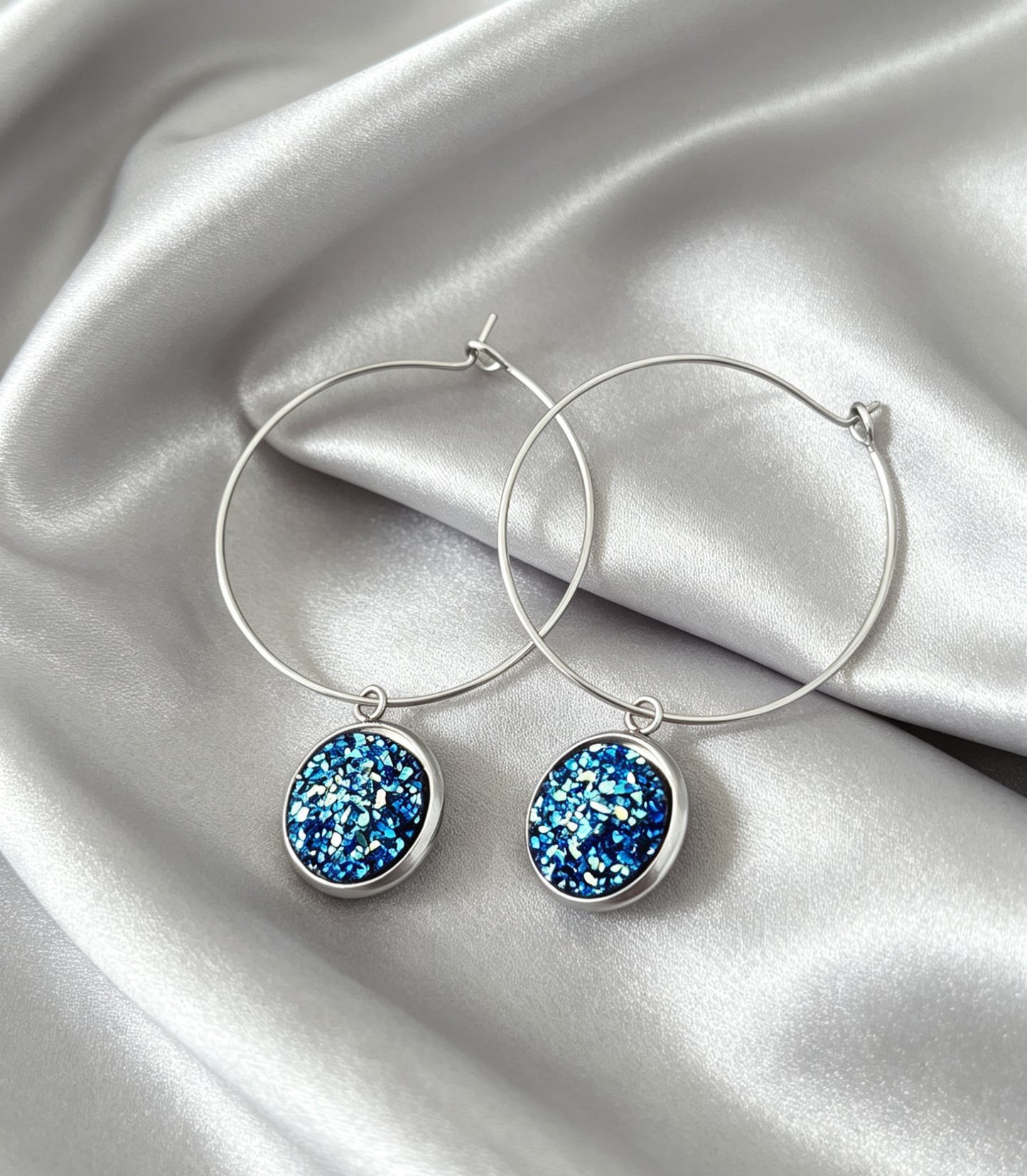 Hoop Earrings with round charm in silver tone