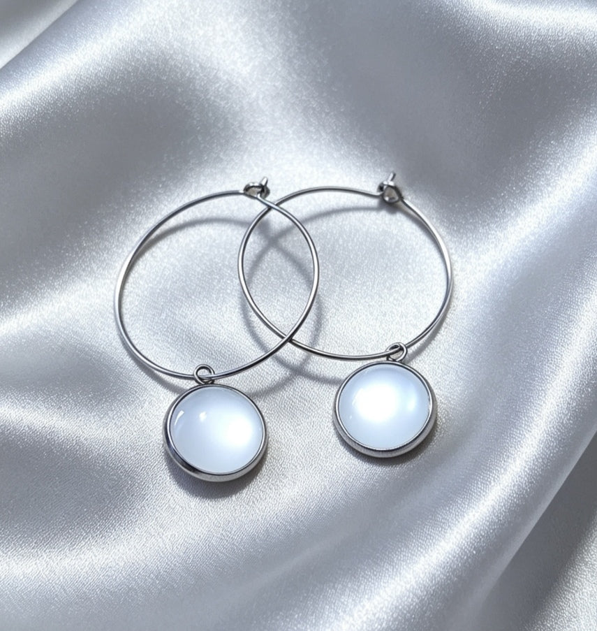 Hoop Earrings with round charm in silver tone