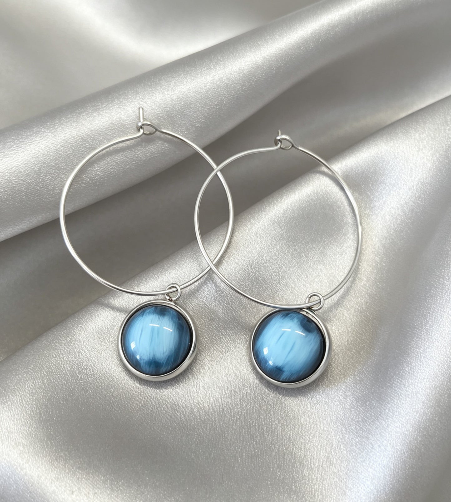 Hoop Earrings with round charm in silver tone