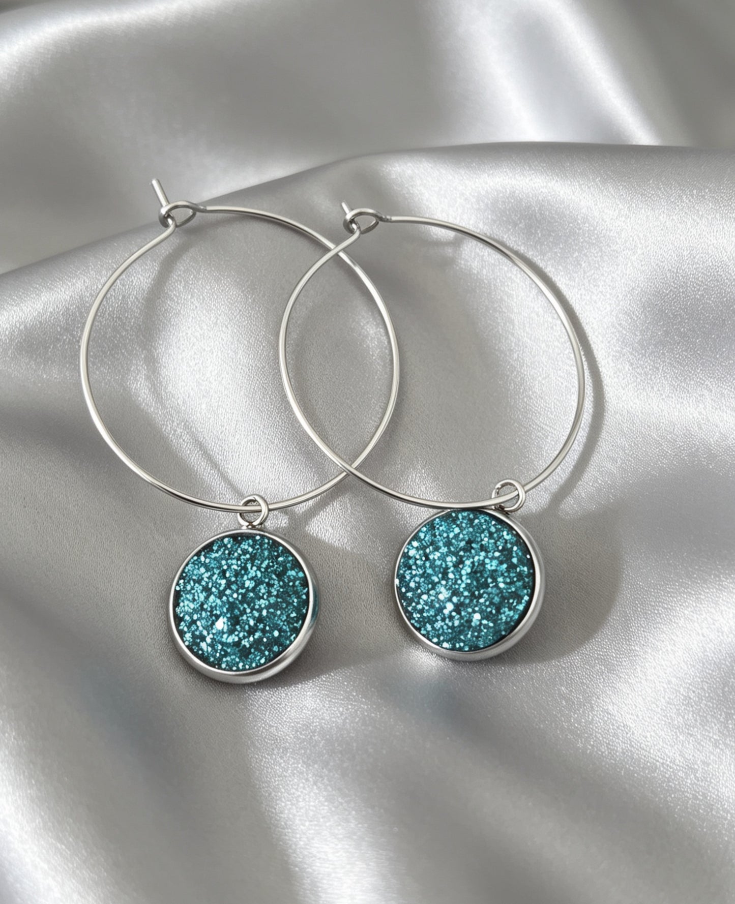 Hoop Earrings with round charm in silver tone