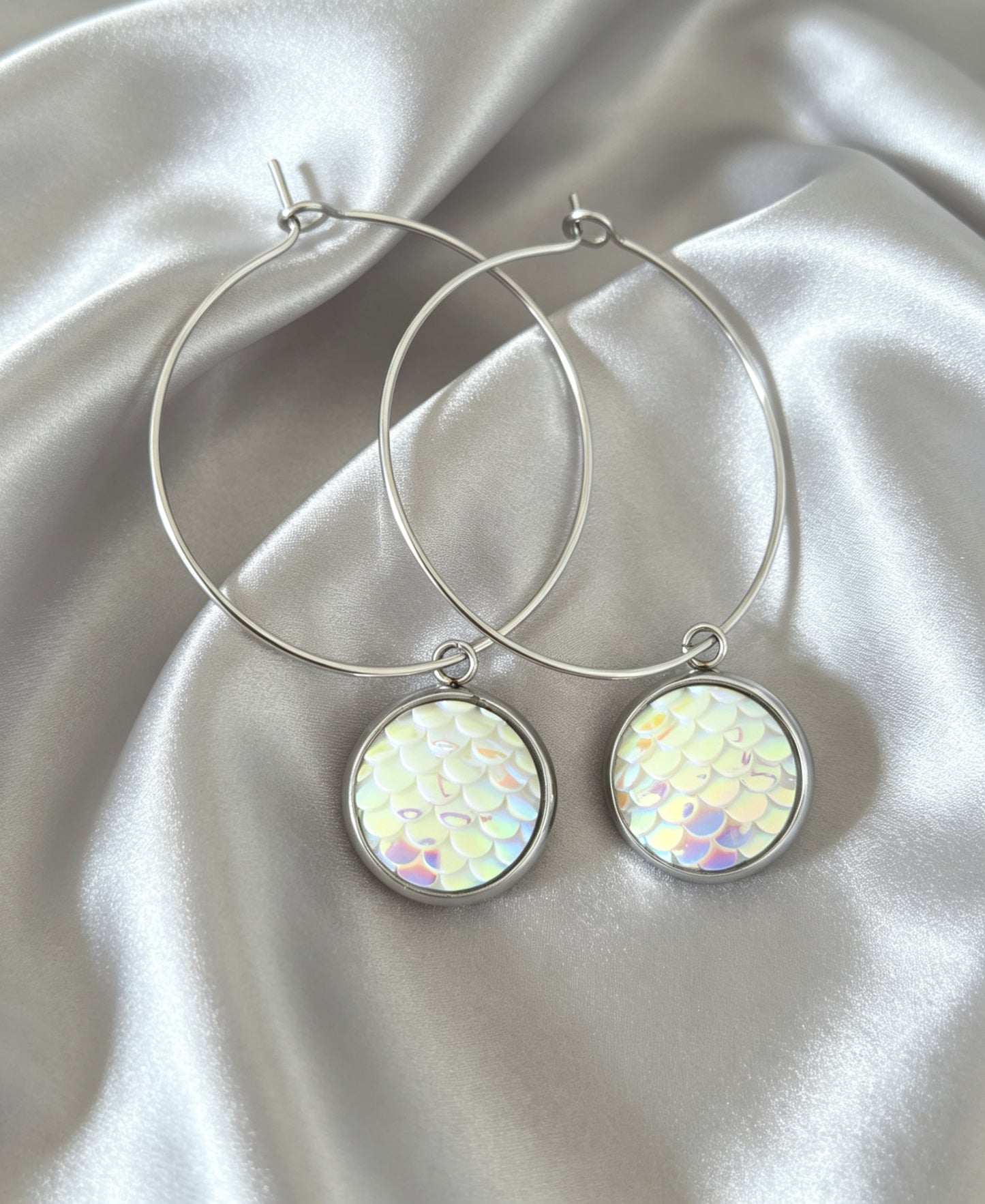 Hoop Earrings with round charm in silver tone