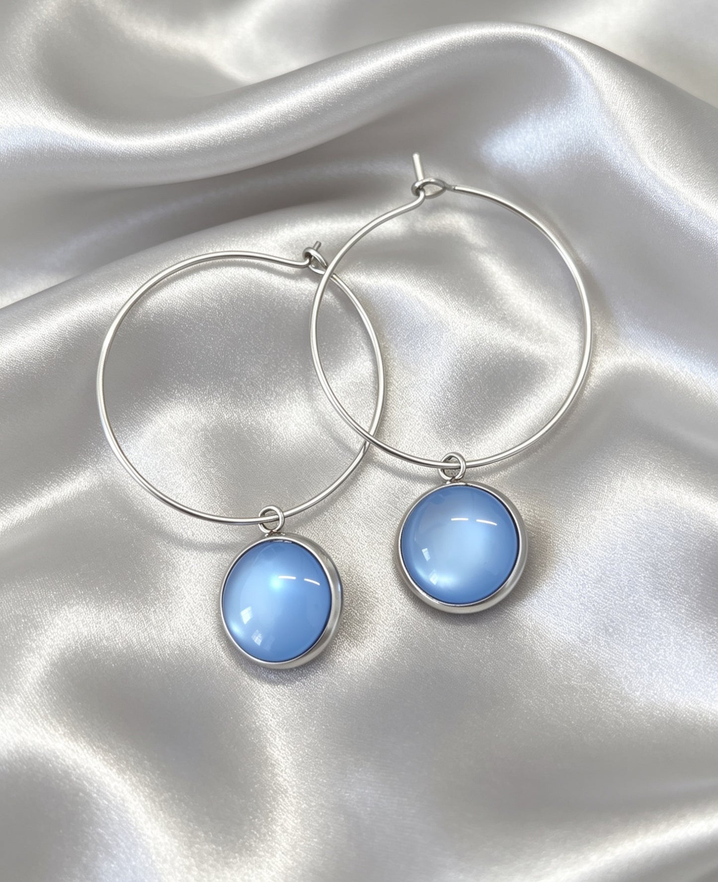 Hoop Earrings with round charm in silver tone