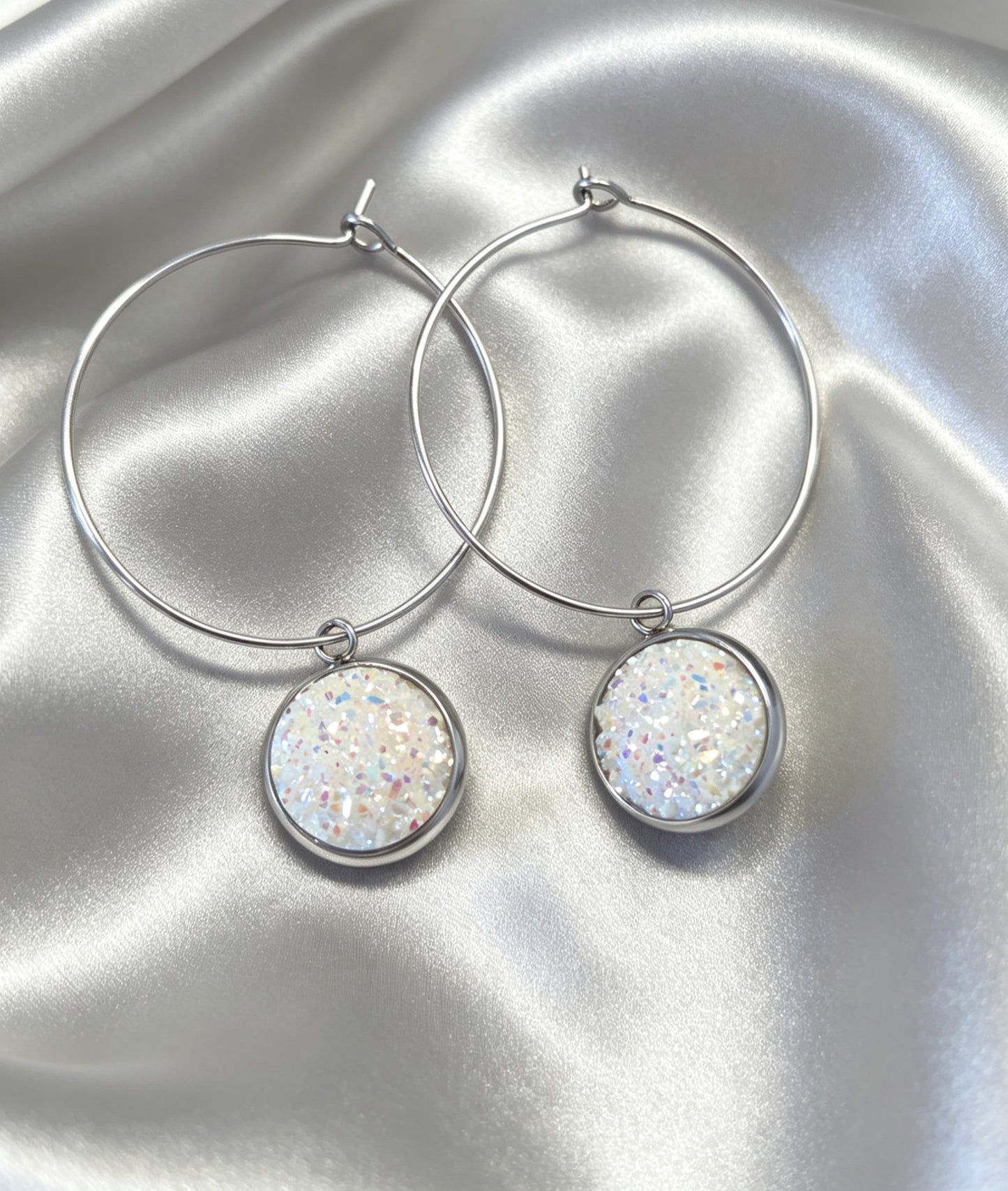 Hoop Earrings with round charm in silver tone