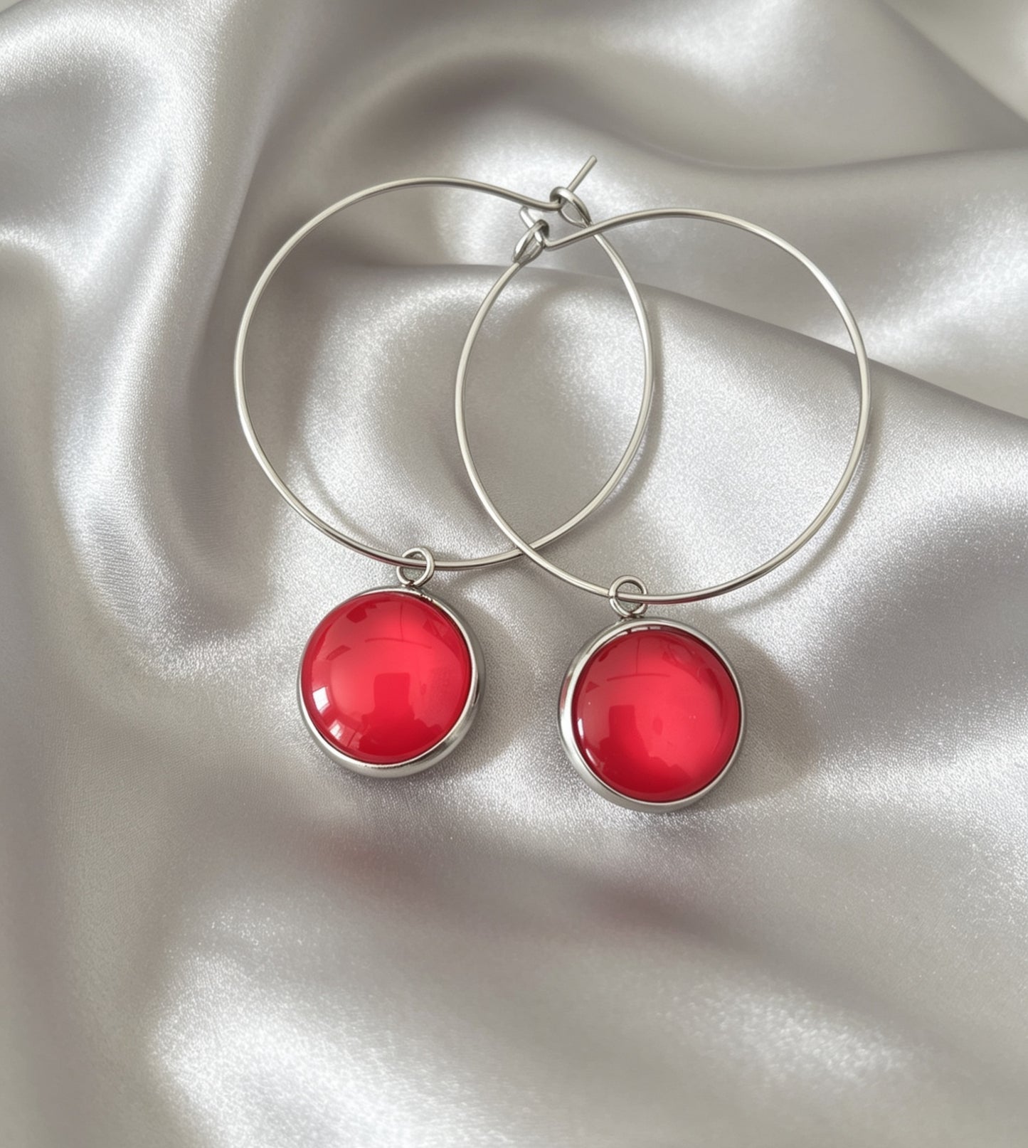 Hoop Earrings with round charm in silver tone
