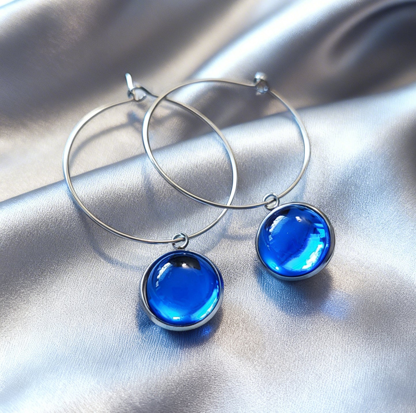 Hoop Earrings with round charm in silver tone