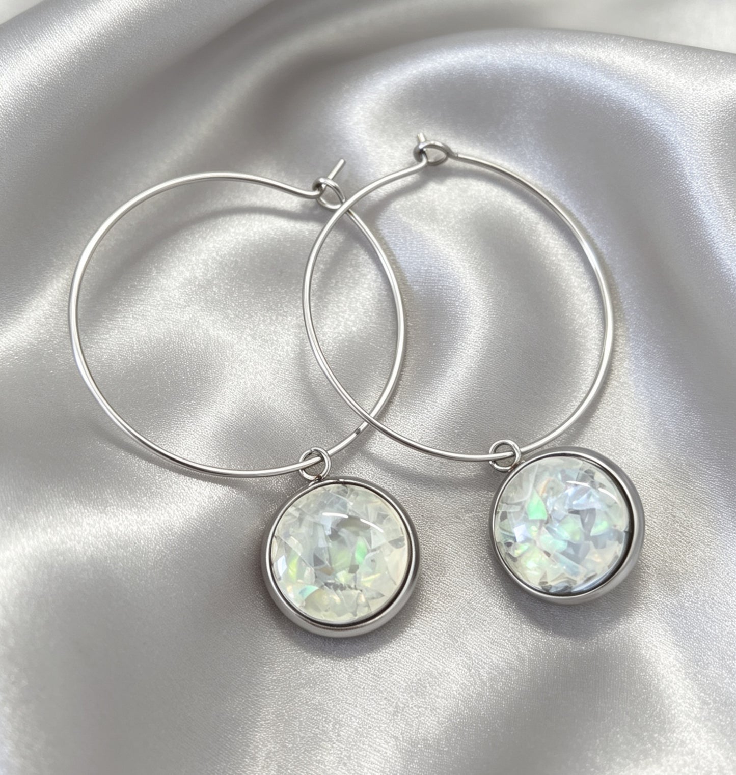 Hoop Earrings with round charm in silver tone