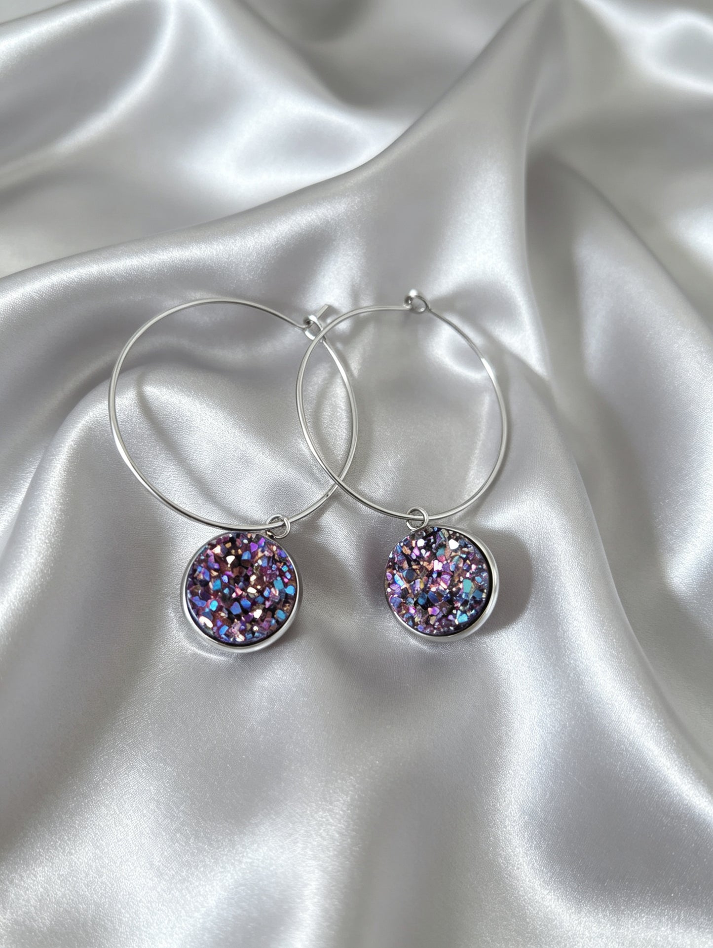 Hoop Earrings with round charm in silver tone