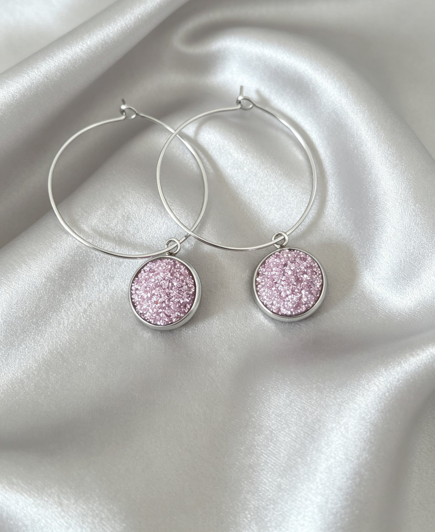 Hoop Earrings with round charm in silver tone