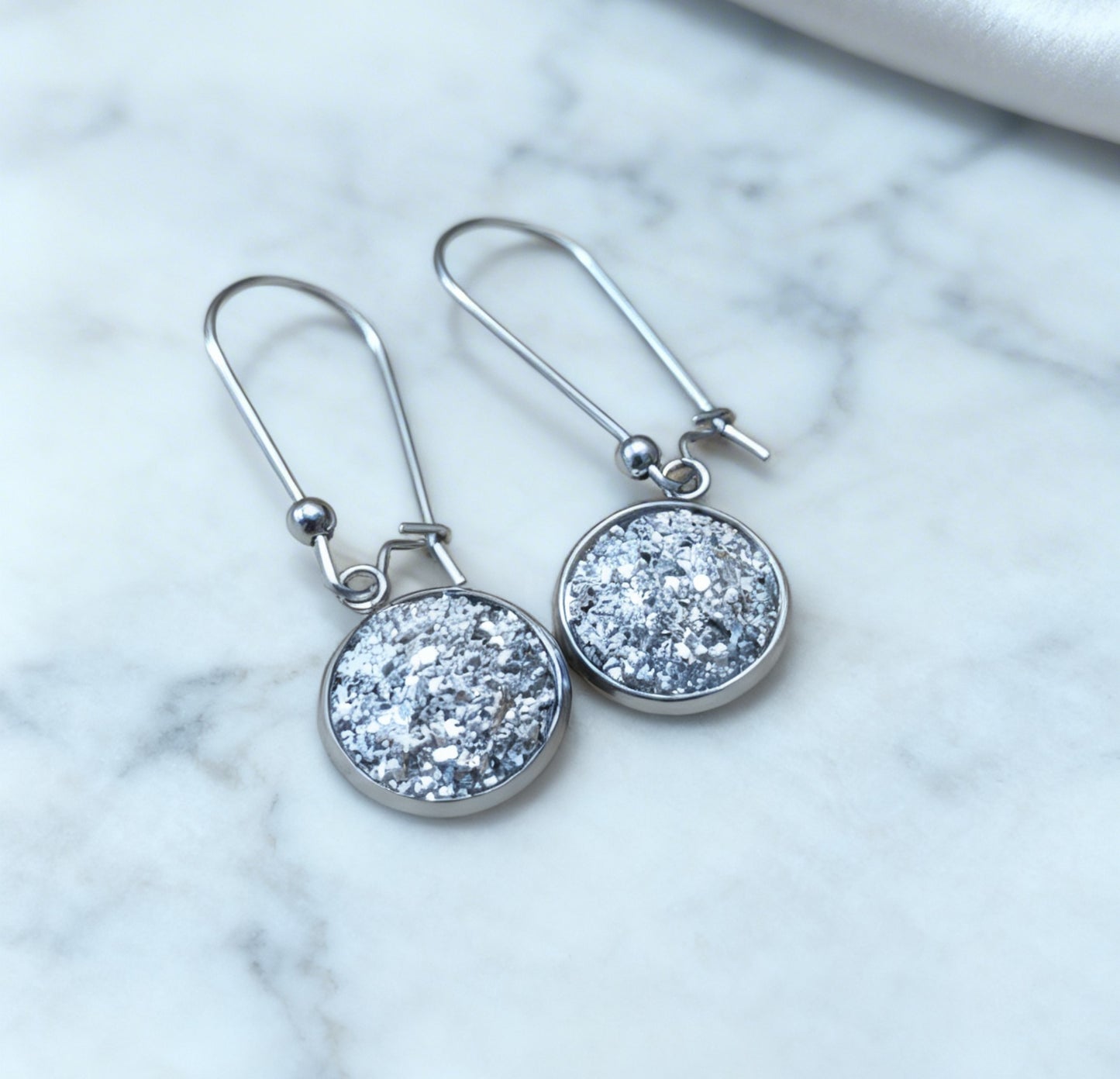 Drop Earrings with round charm in silver tone